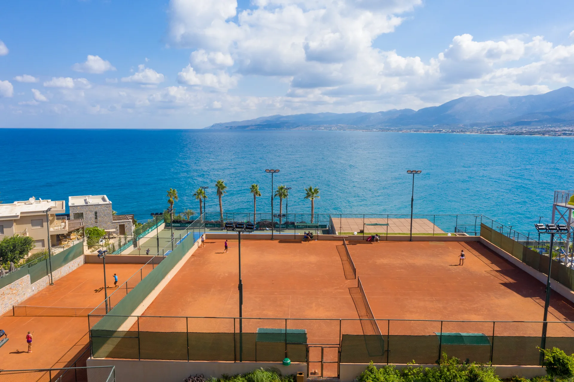 Aerial view of seaside clay tennis courts at Nana Tennis and Sports Club