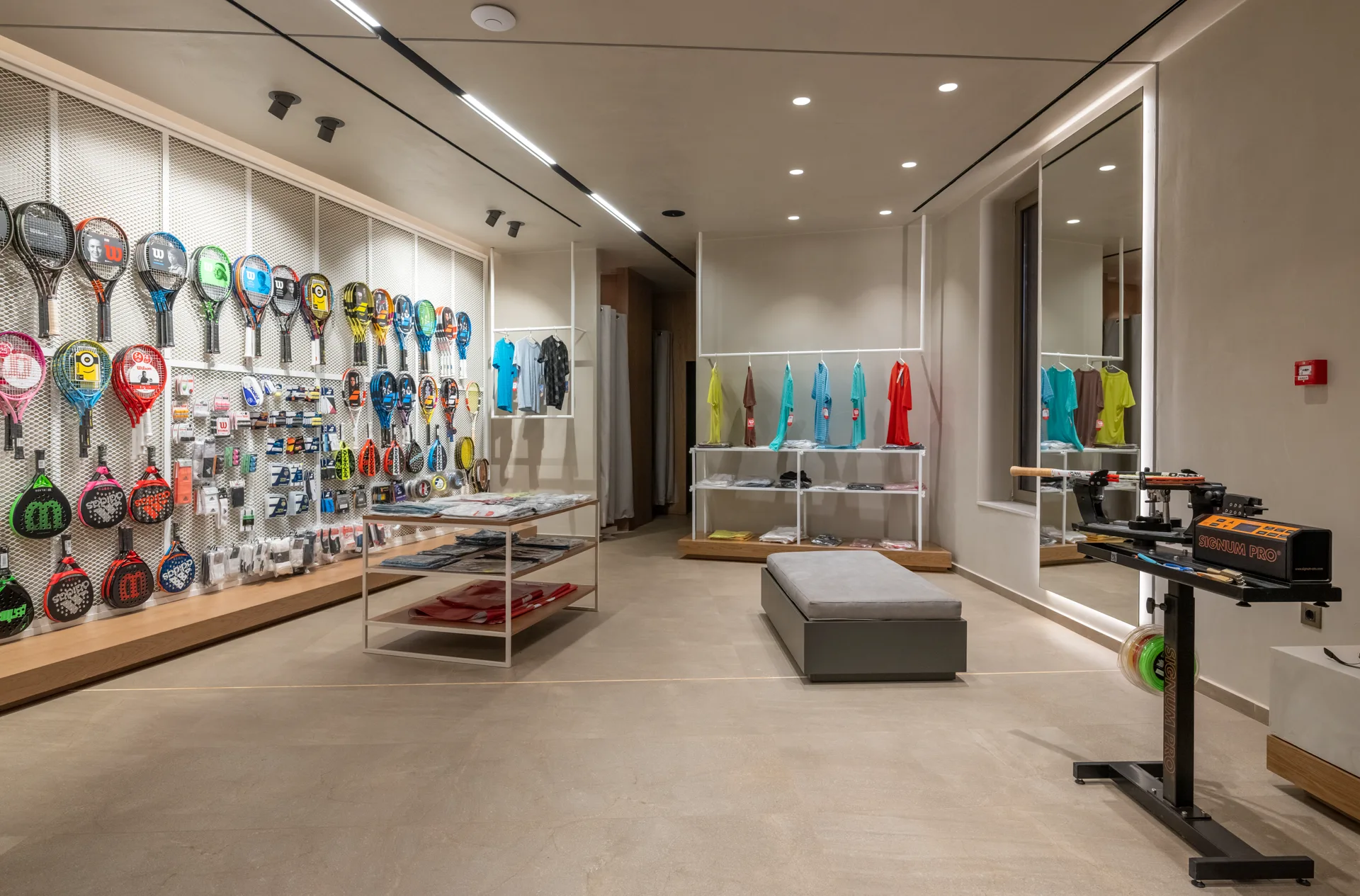 Tennis and padel rackets and sportswear in the club pro shop
