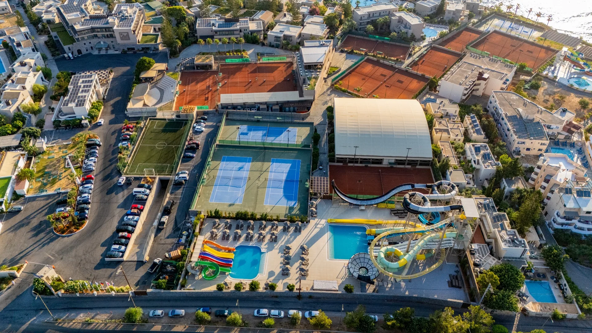 Aerial view of the club with nearby courts and pools